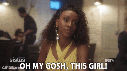 A Woman In A Yellow Dress Is Sitting At A Table With The Words Oh My Gosh This Girl Behind Her GIF