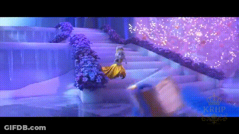 A Woman In A Yellow Dress Is Walking Down A Set Of Stairs In A Purple Room . GIF