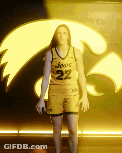 A Woman In A Yellow Iowa 22 Jersey GIF