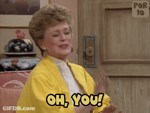 A Woman In A Yellow Jacket Is Clapping And Saying Oh You GIF