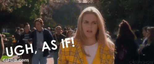 A Woman In A Yellow Plaid Jacket Is Standing In Front Of A Crowd Of People And Says Ugh As If . GIF