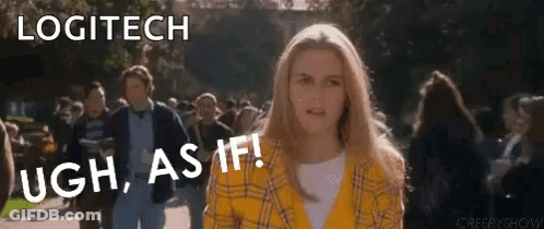 A Woman In A Yellow Plaid Shirt Is Standing In Front Of A Crowd Of People . GIF