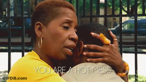 A Woman In A Yellow Shirt Is Hugging A Man With The Words " You Are A Hot Mess " On The Bottom GIF