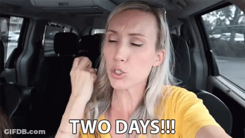A Woman In A Yellow Shirt Is Sitting In A Car And Says Two Days !!! GIF