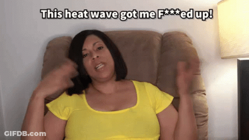 A Woman In A Yellow Shirt Is Sitting On A Couch With The Words This Heat Wave Got Me F *** Ed Up GIF