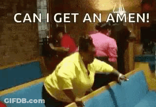 A Woman In A Yellow Shirt Is Standing On A Bench In A Church And Says `` Can I Get An Amen '' . GIF