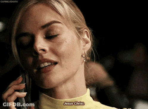 A Woman In A Yellow Shirt Is Talking On A Cell Phone And Says Jesus Christ . GIF