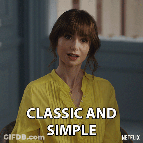A Woman In A Yellow Shirt With The Words Classic And Simple On The Bottom GIF