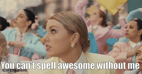 A Woman In A Yellow Suit And Tie Says " You Can 'T Spell Awesome Without Me " In Front Of A Crowd Of People GIF