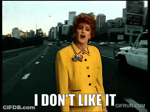 A Woman In A Yellow Suit Stands On A Highway And Says I Don 'T Like It GIF