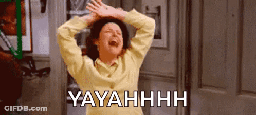 A Woman In A Yellow Sweater Is Laughing With Her Hands In The Air And The Words Yayahhh Written Below Her . GIF
