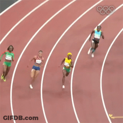 A Woman In A Yellow Top And Green Shorts With The Number 6 On Her Shorts Is Running On A Track . GIF