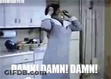 A Woman In An Apron Is Standing In A Kitchen With The Words `` Damn ! Damn ! Damn ! '' . GIF