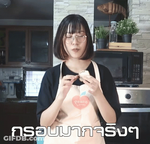 A Woman In An Apron That Says Peach Love GIF