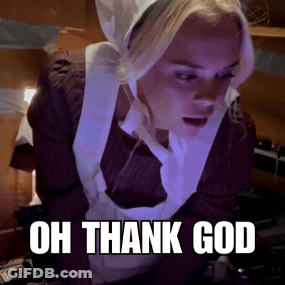 A Woman In An Apron With The Words Oh Thank God Written Below Her GIF