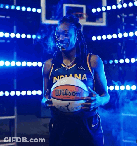 A Woman In An Indiana Jersey Holds A Basketball In Her Hands GIF