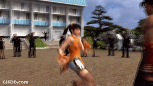 A Woman In An Orange Dress Is Running In A Field GIF