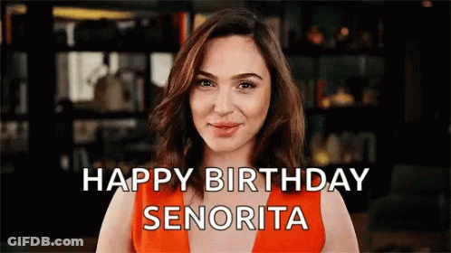 A Woman In An Orange Dress Says Happy Birthday Senorita GIF
