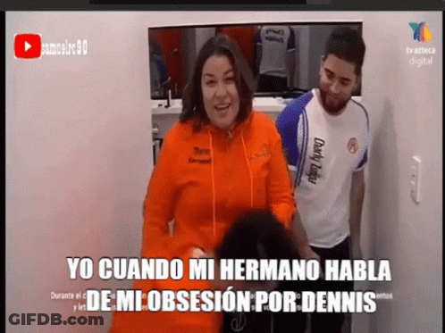 A Woman In An Orange Hoodie Is Standing Next To A Man In A White Shirt GIF