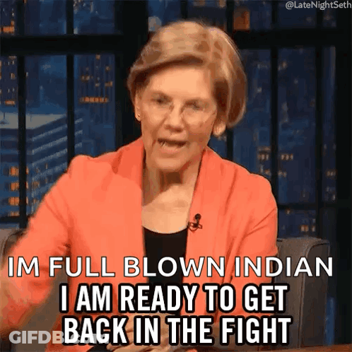 A Woman In An Orange Jacket Is Saying I 'M Full Blown Indian I Am Ready To Get Back In The Fight . GIF