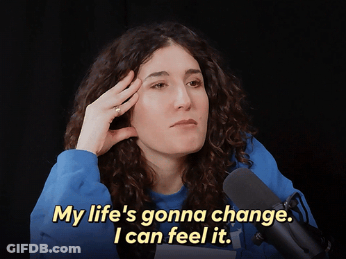 A Woman In Front Of A Microphone Says " My Life 'S Gonna Change .. I Can Feel It " GIF