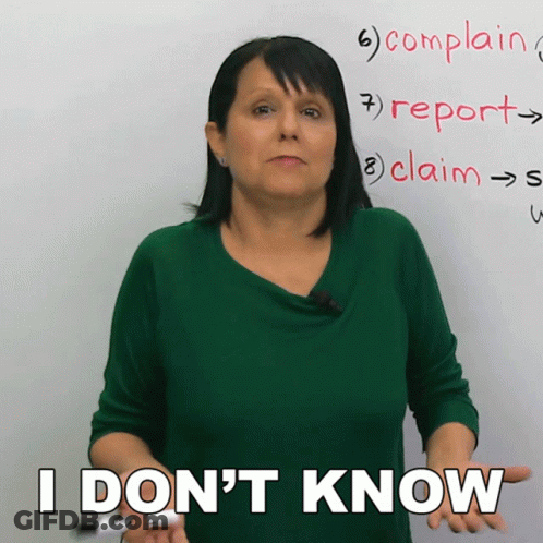 A Woman In Front Of A White Board Says I Don T Know GIF