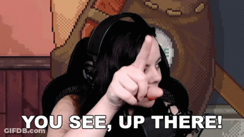 A Woman In Headphones Giving A Thumbs Up With The Words You See Up There Below Her GIF