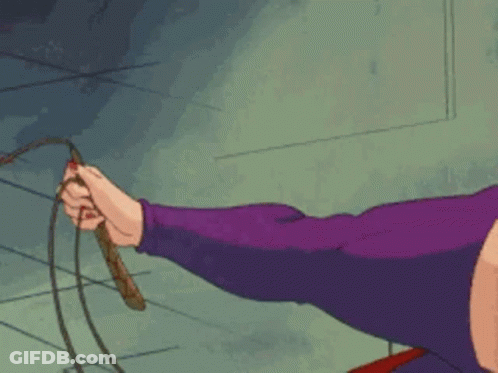 A Woman In Purple Gloves Is Holding A Whip In Her Hand GIF