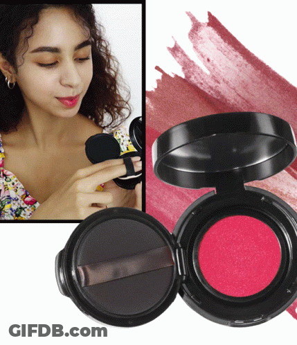 A Woman Is Applying Lipstick To Her Lips Next To A Container Of Lipstick GIF