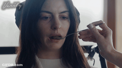 A Woman Is Being Fed With A Spoon And The Word Verity Is On The Bottom Right GIF