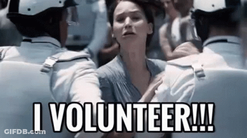 A Woman Is Being Held By A Group Of Police Officers And Says `` I Volunteer !! '' GIF