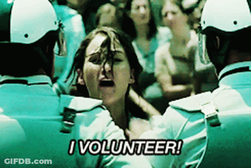 A Woman Is Being Held By Police Officers And Says " I Volunteer " GIF