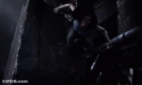 A Woman Is Being Pulled By A Rope In A Dark Room And Screaming . GIF
