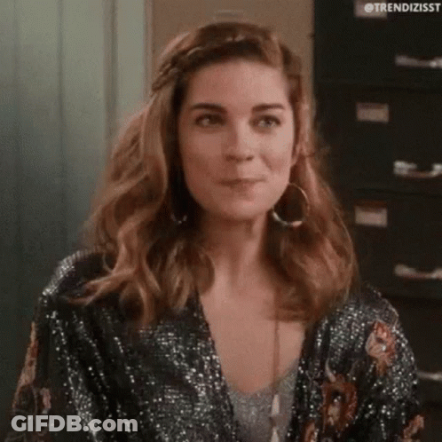 Woman Clapping In Room Wearing Black Dress And Hoop Earrings GIF