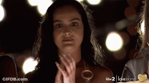 A Woman Is Clapping In A Love Island Ad GIF