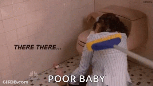 A Woman Is Cleaning A Bathroom Floor With A Broom And Says `` Poor Baby '' . GIF