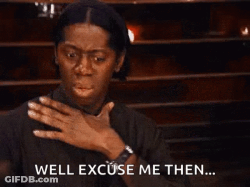 A Woman Is Covering Her Chest With Her Hand And Saying `` Well Excuse Me Then '' . GIF