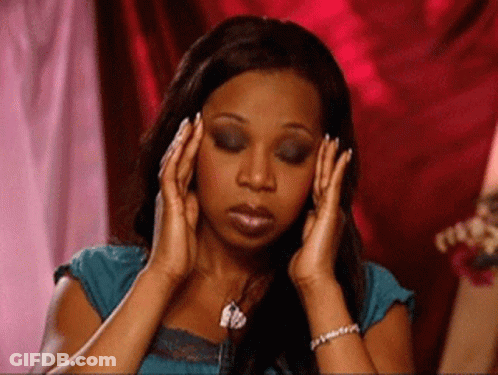 A Woman Is Covering Her Ears With Her Hands . GIF