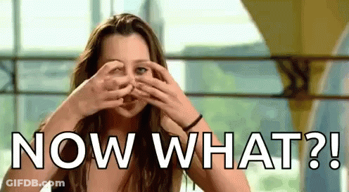 A Woman Is Covering Her Eyes With Her Hands And The Words Now What ? GIF