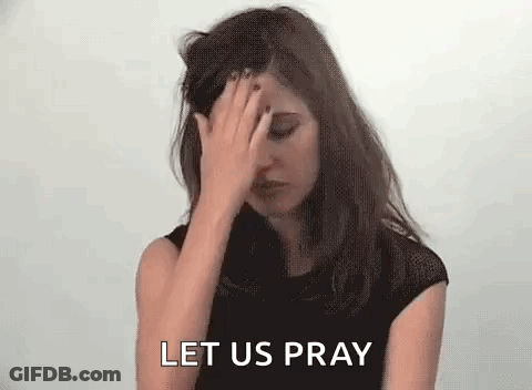 A Woman Is Covering Her Face With Her Hand And The Words `` Let Us Pray '' Are Behind Her . GIF