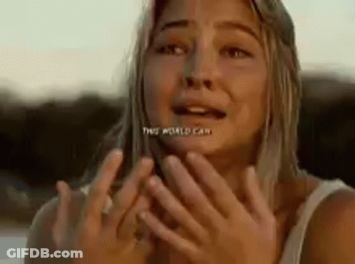 A Woman Is Covering Her Face With Her Hands And Making A Funny Face . GIF
