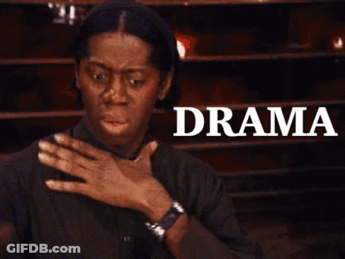 A Woman Is Covering Her Mouth In Front Of A Sign That Says " Drama " GIF