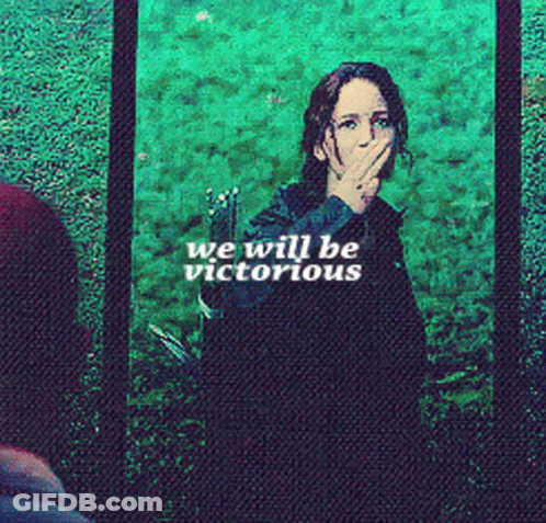 A Woman Is Covering Her Mouth With Her Hand And The Words We Will Be Victorious GIF