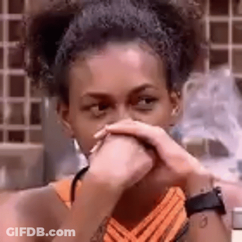 Woman Covering Mouth With Hands Looking At Camera GIF