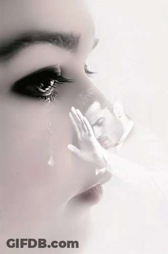 A Woman Is Crying And A Man Is Covering His Face GIF
