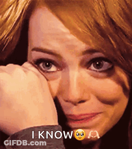 A Woman Is Crying And Covering Her Face With Her Hand And The Words I Know Are Above Her GIF