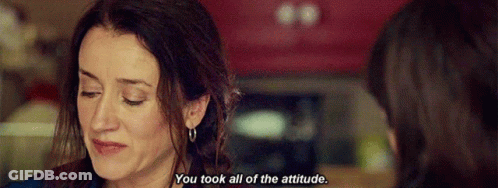 A Woman Is Crying And Talking To Another Woman In A Kitchen . GIF