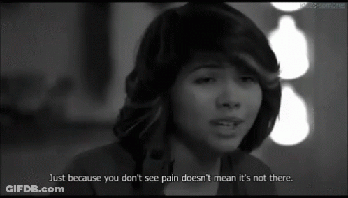 A Woman Is Crying In A Black And White Photo With A Quote That Says Just Because You Don 'T See Pain GIF