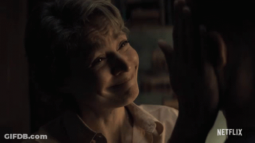 A Woman Is Crying In Front Of A Man With Netflix Written On The Bottom GIF