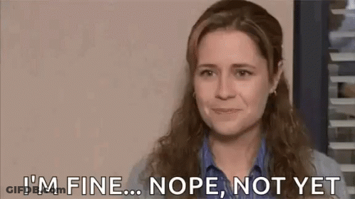A Woman Is Crying While Covering Her Face With Her Hand . GIF